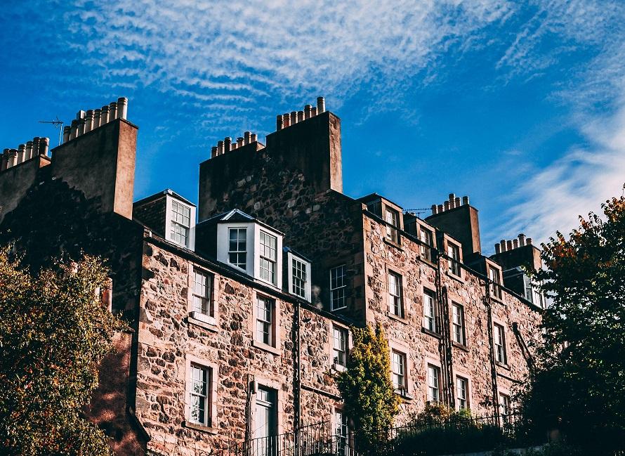 A photograph of two adjacent tenement buildings.